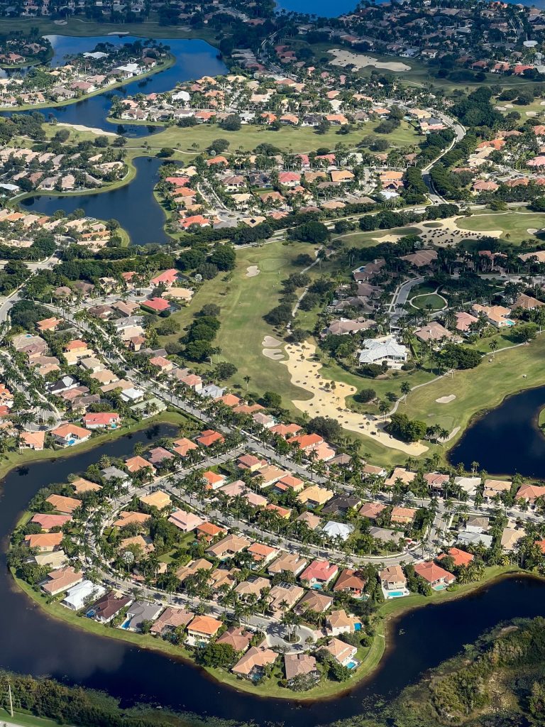Neighborhood homes among lakes and a golf course